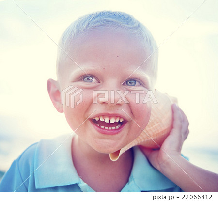 Little boy having fun on a beach Concept Little boy having fun on a beach Concept 22066812