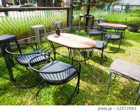 Chairsand wood table in coffee shop for relaxing Chairsand wood table in coffee shop for relaxing 22072663