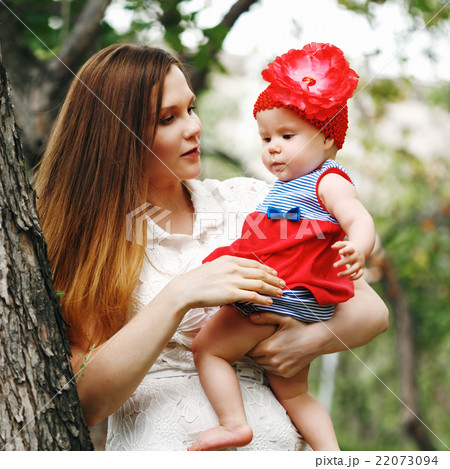 Mother and Daughter Together in Park Mother and Daughter Together in Park 22073094