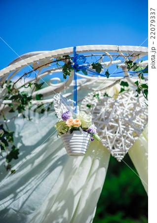 Fragment of creatively decorated wedding arch 22079337