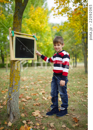 little happy boy writing on blackboard little happy boy writing on blackboard 22092065