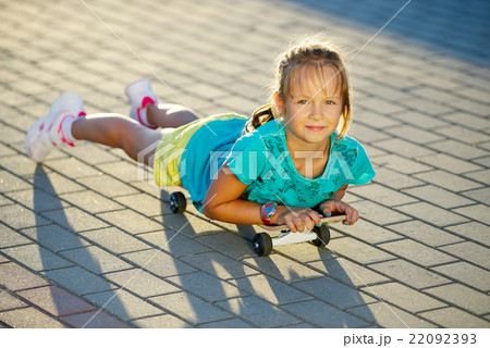 photo of cute little girl with skateboard photo of cute little girl with skateboard 22092393
