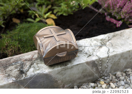 Holy water shell at the grave Holy water shell at the grave 22092523