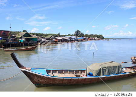 Close up head of long tail boat with goods in sea Close up head of long tail boat with goods in sea 22096328