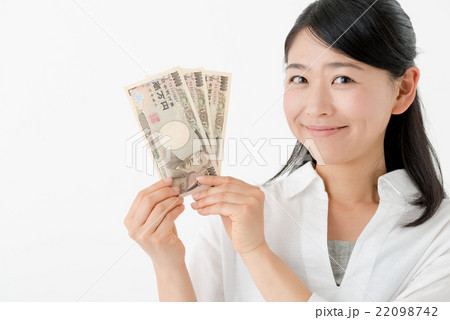 お金を持った女性の写真素材