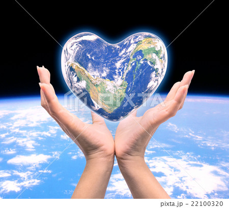 World in heart shape with over women human hands World in heart shape with over women human hands 22100320