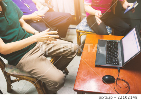 Professional team of talking a project on laptop 22102148