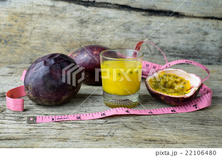 Passion fruits with glass of passion fruit juices Passion fruits with glass of passion fruit juices 22106480