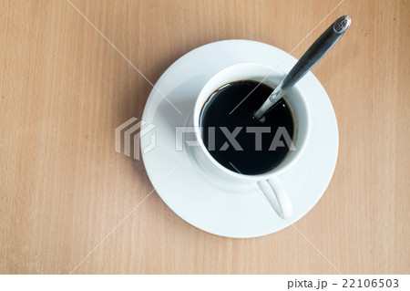 Coffee cup top view on wooden table background 22106503