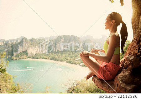 young healthy woman practice yoga on mountain peak rock young healthy woman practice yoga on mountain peak rock 22112536