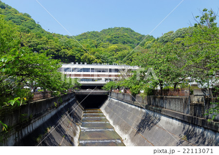 神戸 新緑の生田川と新神戸駅の写真素材