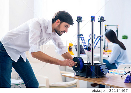 Pleasant man using 3d printer 22114467