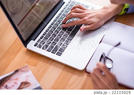 Pleasant person working on the laptop Pleasant person working on the laptop 22115029