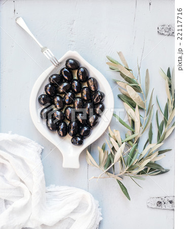 Black olives in white ceramic plate with tree 22117716
