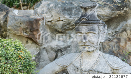 Ancient old man's face statue in asian style. Ancient old man's face statue in asian style. 22122677