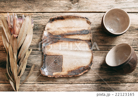 Rustic creative brown pottery empty big dish  22123165