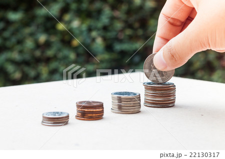 Woman hand putting money coin Woman hand putting money coin 22130317