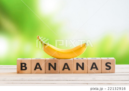 Banana sign with a yellow banana on top Banana sign with a yellow banana on top 22132916