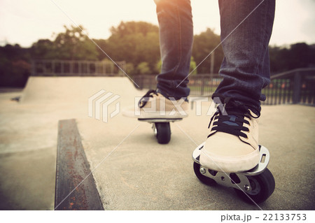 skateboarding legs on free line at skatepark ramp 22133753
