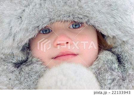 Child in a fur cap. Close up portrait. Blue eyes Child in a fur cap. Close up portrait. Blue eyes 22133943