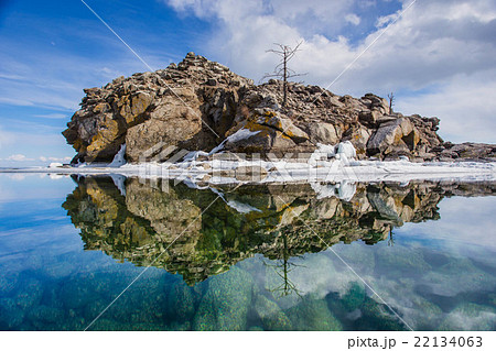 Mirroring island in water at Lake Baikal 22134063