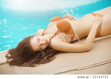 sexy girl lying at a pool 22134725