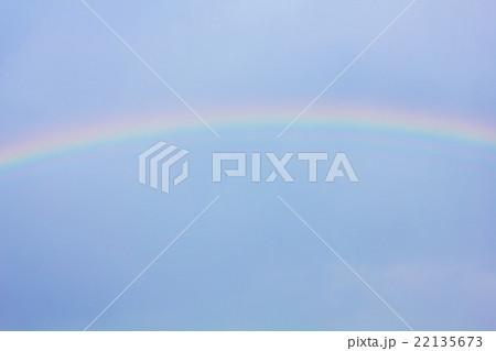 Rainbow in the blue sky as background 22135673