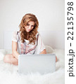Woman sitting on the sofa with laptop. 22135798