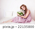Smiling woman with flowers. 22135800