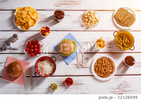 Burger with cutlery and chips. Burger with cutlery and chips. 22136099