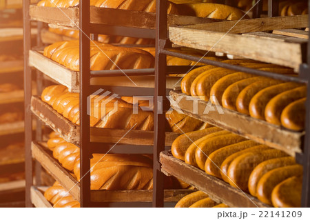 Bread stacked on the shelves.  22141209