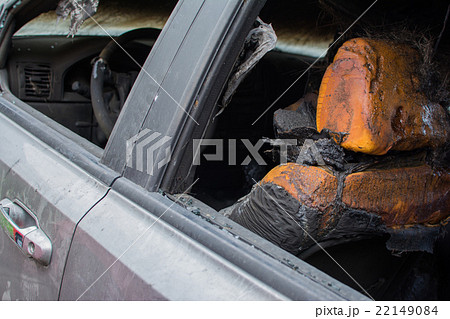 Burned gray car. 22149084