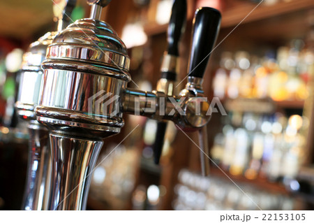 Chrome beer taps with highlights in the pub Chrome beer taps with highlights in the pub 22153105