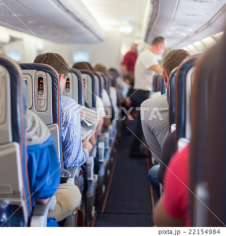 Passengers on commercial airplane. 22154984