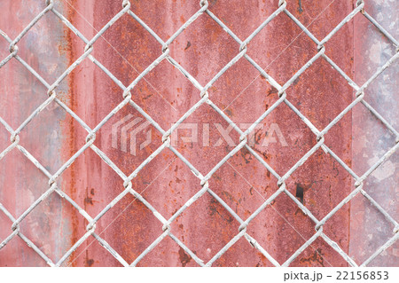 Steel wire mesh on rusty galvanized background. Steel wire mesh on rusty galvanized background. 22156853