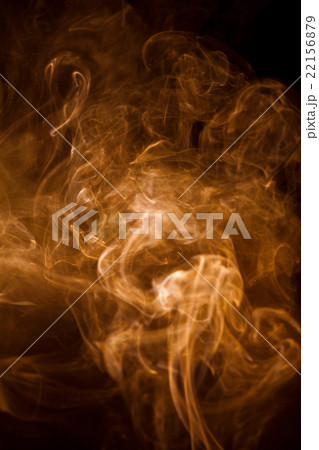 Orange smoke on a black background. Orange smoke on a black background. 22156879