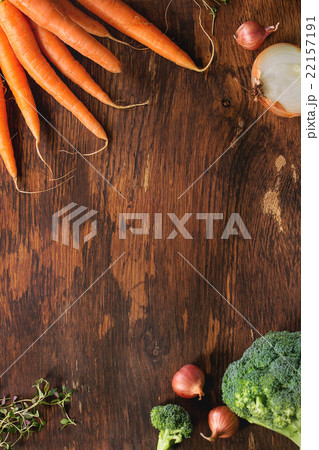 Wooden background with vegetables Wooden background with vegetables 22157191