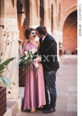 Young couple in love bride and groom posing near Young couple in love bride and groom posing near 22159271