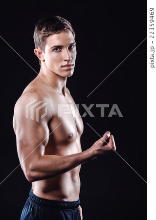 Fitness boy on black background Fitness boy on black background 22159469