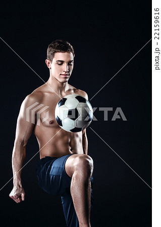Football player on black background Football player on black background 22159616