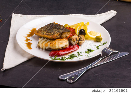 Grilled fish steak with vegetables Grilled fish steak with vegetables 22161601