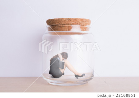 business woman imprisoned in jar 22168951