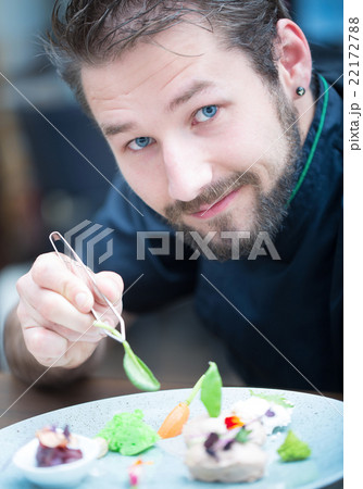 Chef in hotel or restaurant kitchen cooking hands Chef in hotel or restaurant kitchen cooking hands 22172788