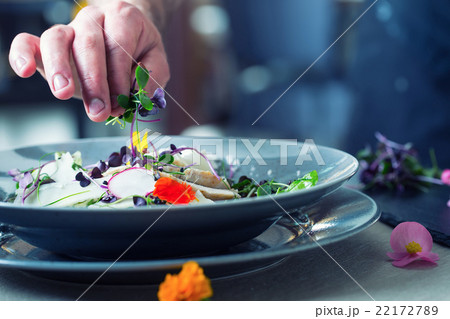 Chef in hotel or restaurant kitchen cooking hands Chef in hotel or restaurant kitchen cooking hands 22172789