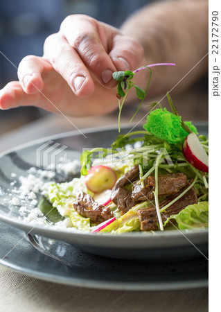 Chef in hotel or restaurant kitchen cooking hands Chef in hotel or restaurant kitchen cooking hands 22172790