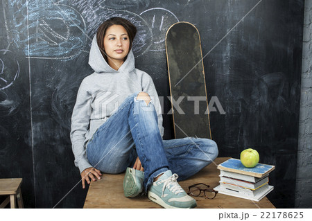 young cute teenage girl in classroom at blackboard young cute teenage girl in classroom at blackboard 22178625
