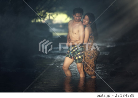 Asian couple bathing at cascade 22184539