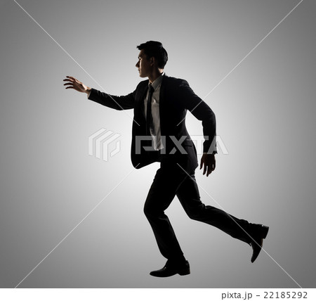 Confident businessman running 22185292