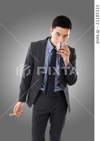 businessman holding a cigar businessman holding a cigar 22185333