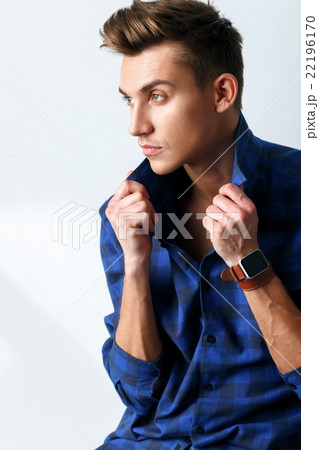 Attractive young guy is evincing his seriousness 22196170